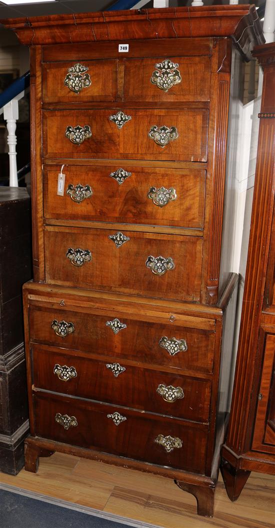 A slender Georgian style walnut chest on chest, W.78cms